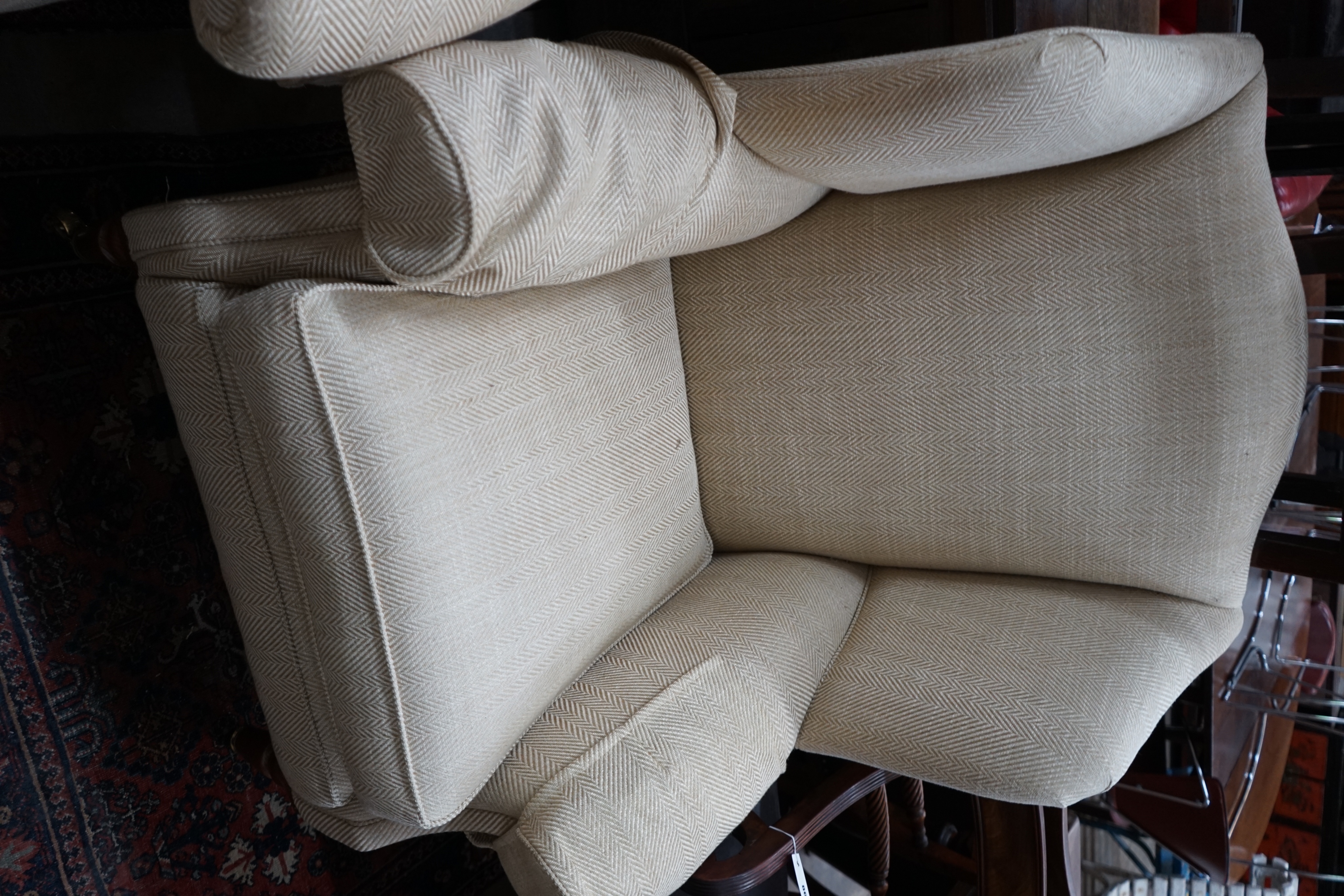 A pair of Duresta wing armchairs, upholstered in a natural herringbone fabric, width 92cm depth 80cm height 114cm